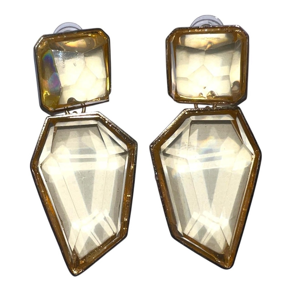 Golden geometric clear crystal earrings.